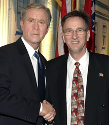 President Bush impersonator withSecret Service Singers